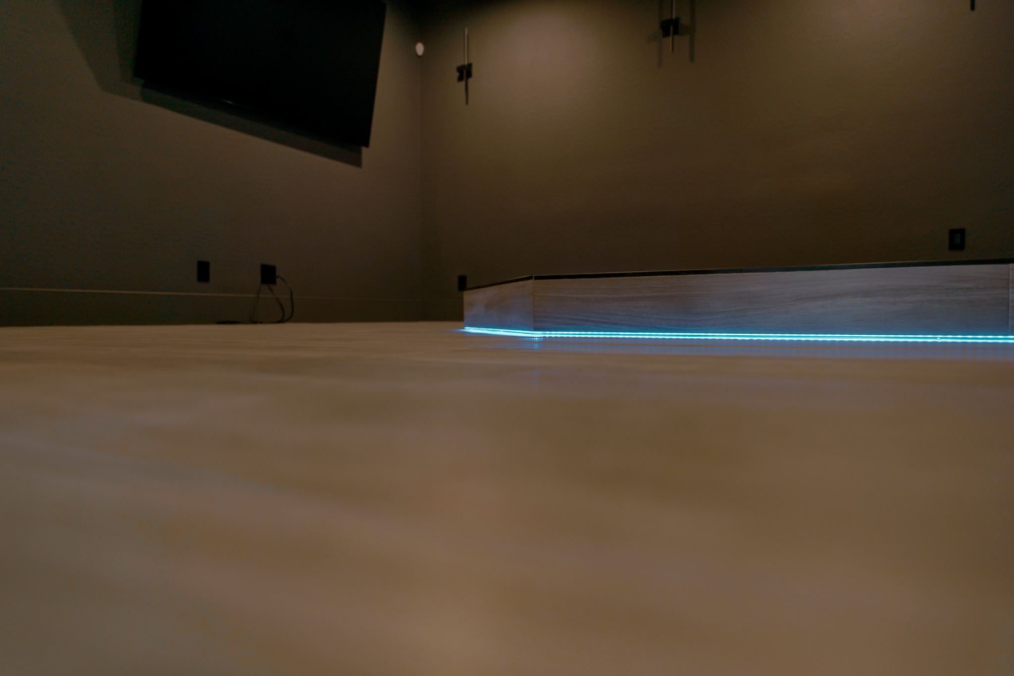 Contemporary electric fireplace with blue and orange flame effect and crystal ember bed.