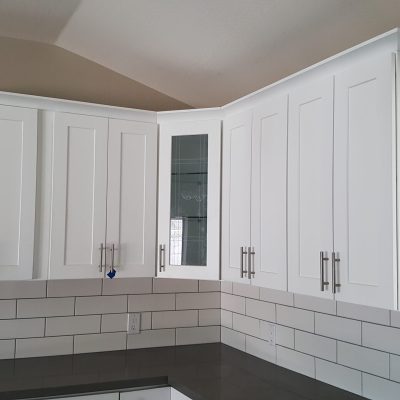 Mesa kitchen white shaker upper cabinets dark gray countertops subway tile