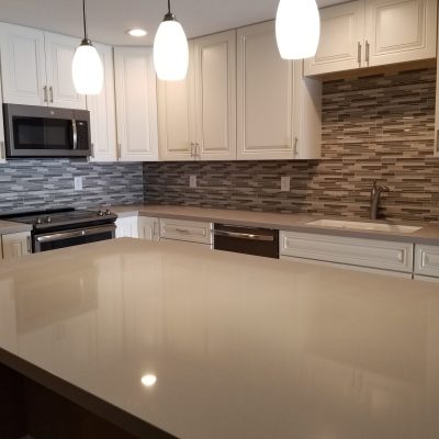 Mesa kitchen off-white cabinets gray quartz countertops mosaic tile backsplash