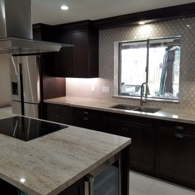 Mesa kitchen dark cabinets light granite countertops fish scale backsplash