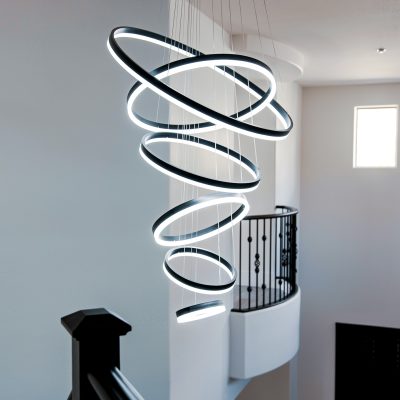 Unique spiral pendant light with eight illuminated circular rings.