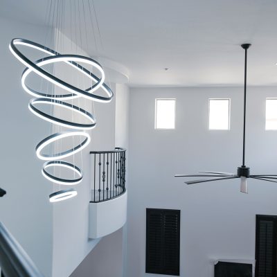 Unique spiral LED pendant light fixture with multiple illuminated rings.